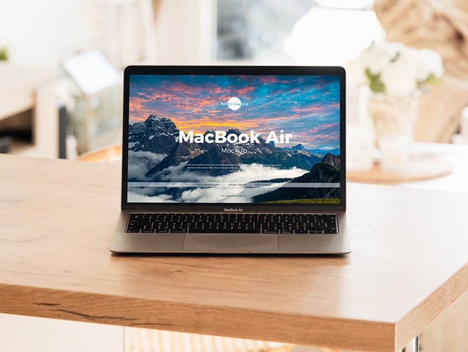 Free Interior MacBook Air on Table Mockup