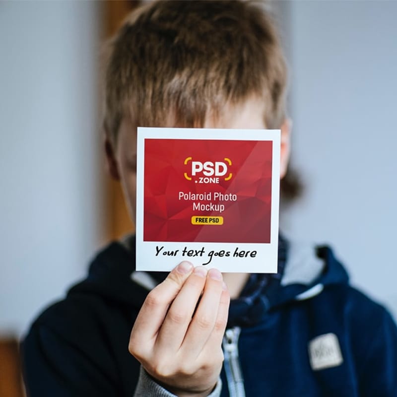 Hand Holding Polaroid Photo Mockup