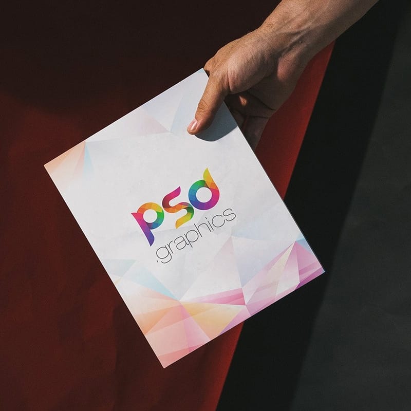 Man Holding A4 Paper Mockup