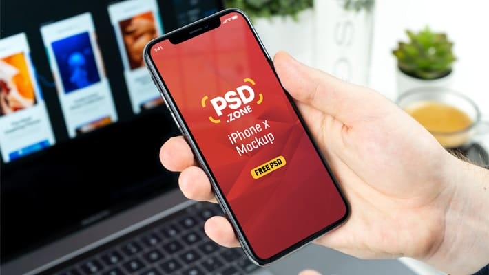 Man Holding iPhone X Mockup PSD