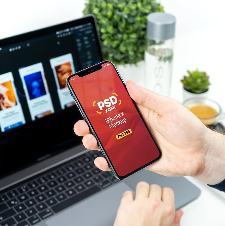 Man Holding iPhone X Mockup PSD
