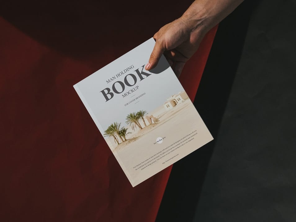 Free Man Holding Book Mockup For Cover Branding