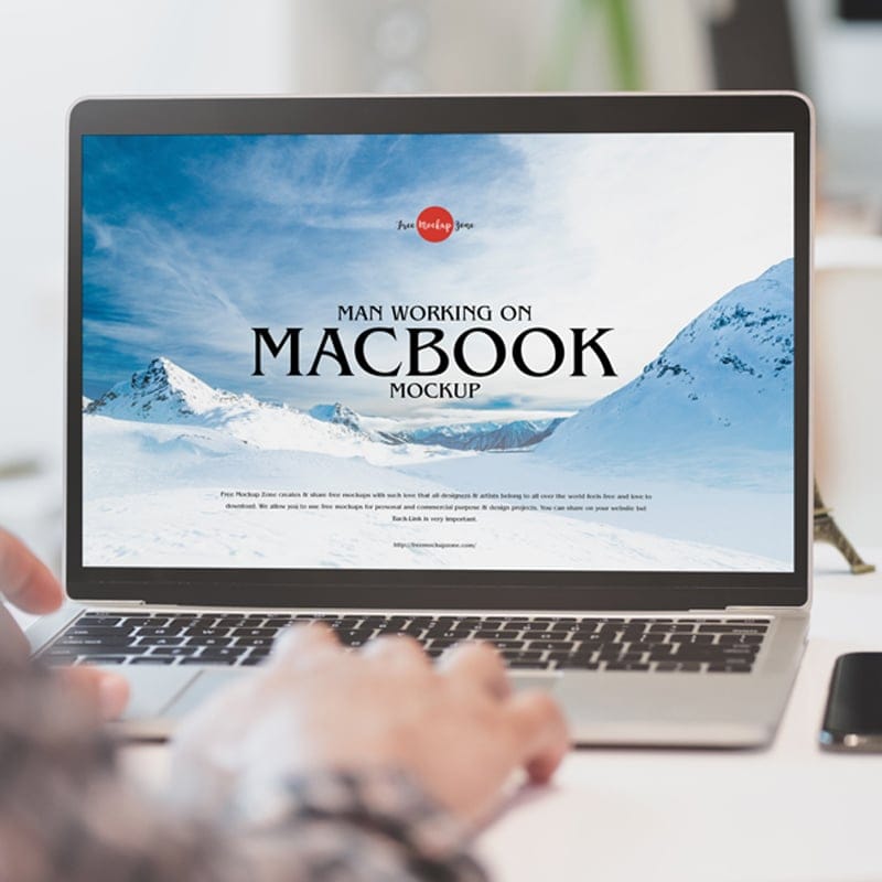Free Man Working on MacBook Mockup