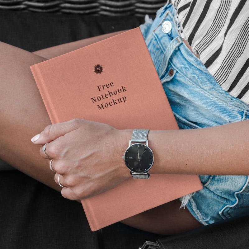 Hand Holding Notebook Mockup