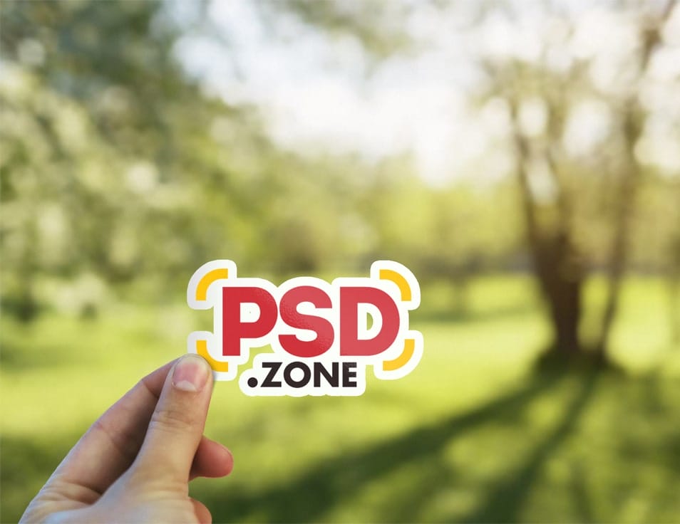Hand Holding Sticker Mockup PSD
