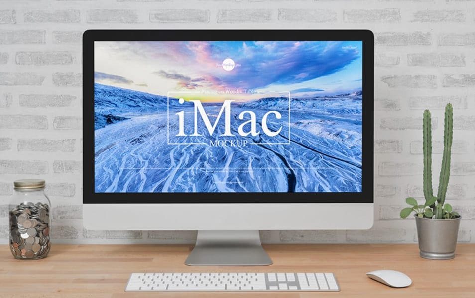 Free iMac Placing on Wooden Table Mockup
