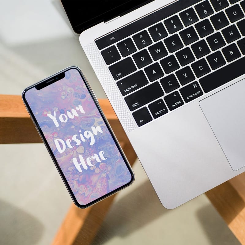 iPhone next to MacBook Pro Mockup
