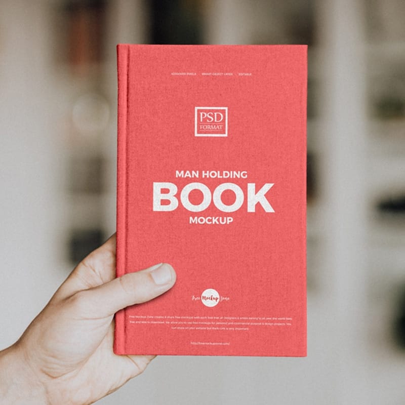 Free Man Holding Book Mockup