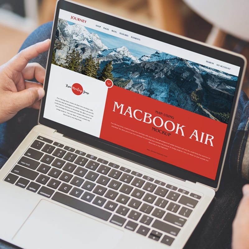 Free Man Using MacBook Air Mockup