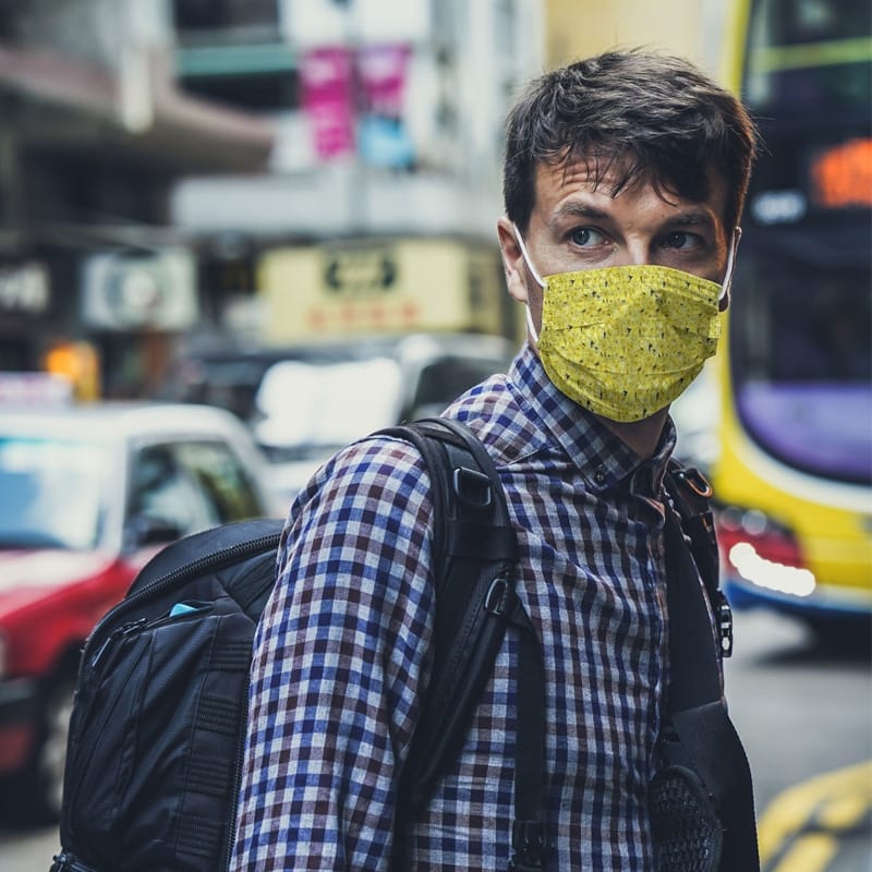 Man in Face Mask in City