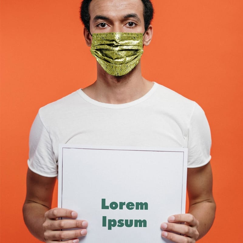 Man in a Face Mask Holding the Poster