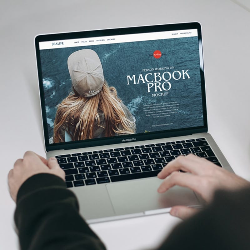Free Person Working on MacBook Pro Mockup