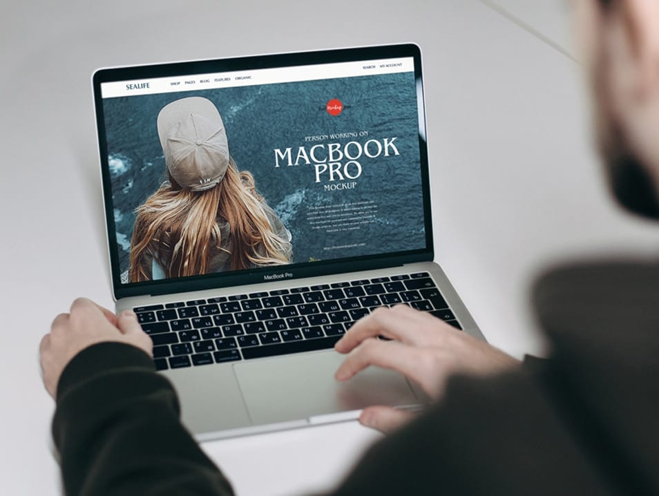 Free Person Working on MacBook Pro Mockup