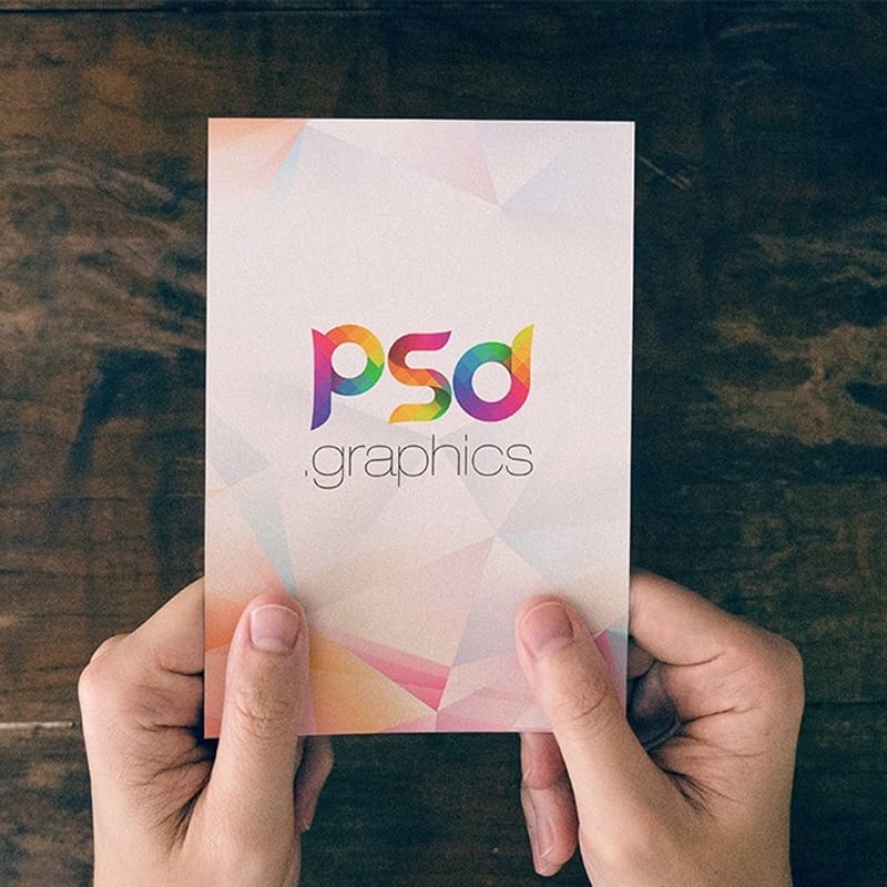 Holding Post Card in Hand Mockup