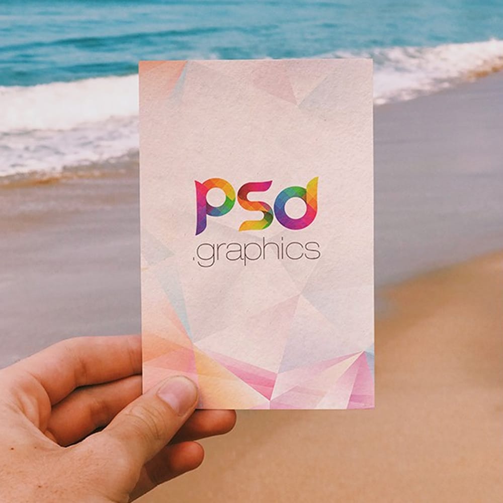 Holding Post Card in Hand Mockup PSD