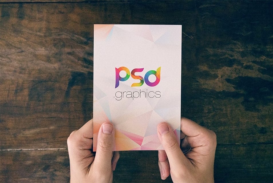Holding Post Card in Hand Mockup