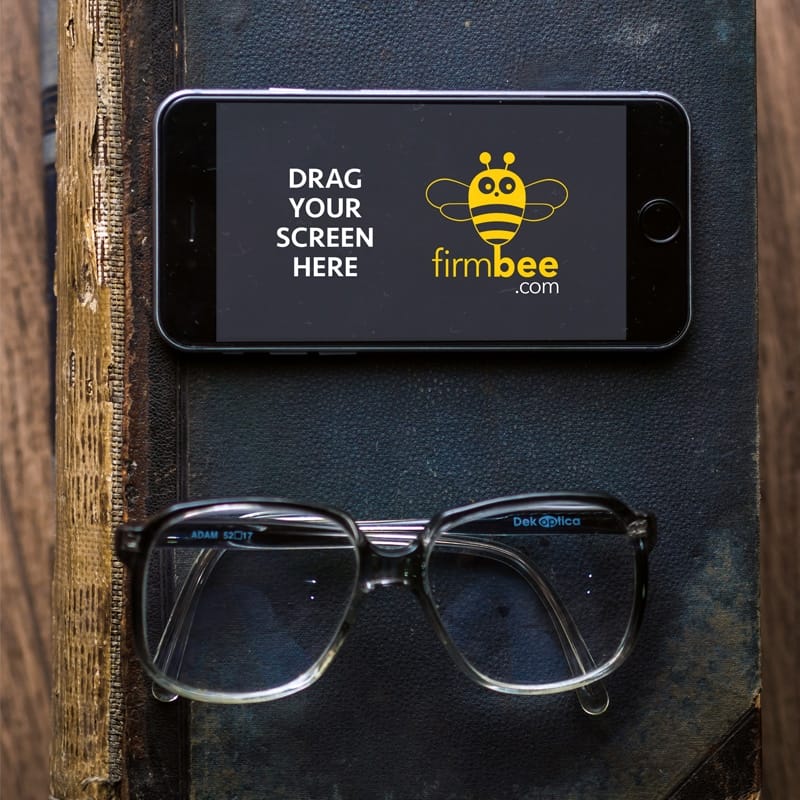 iPhone 6s with Glasses and Old Book