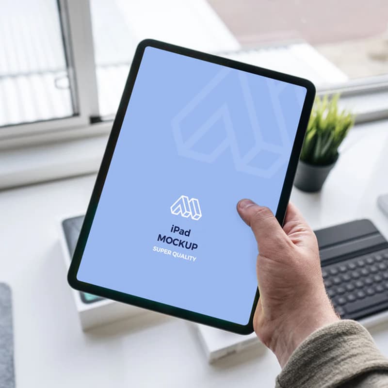Tablet In Hand Mockup