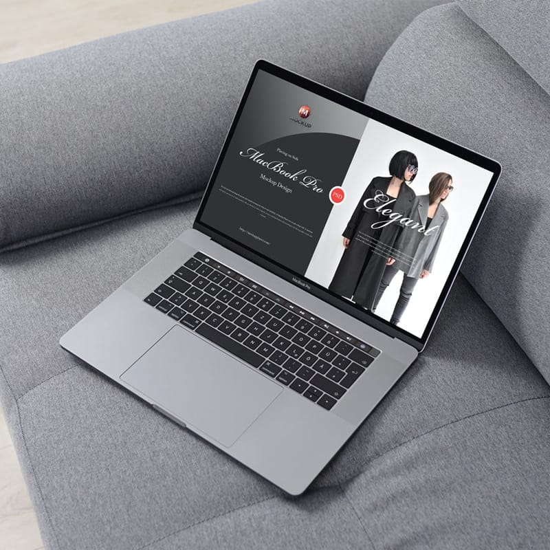 Free MacBook Pro Placing on Sofa Mockup Design