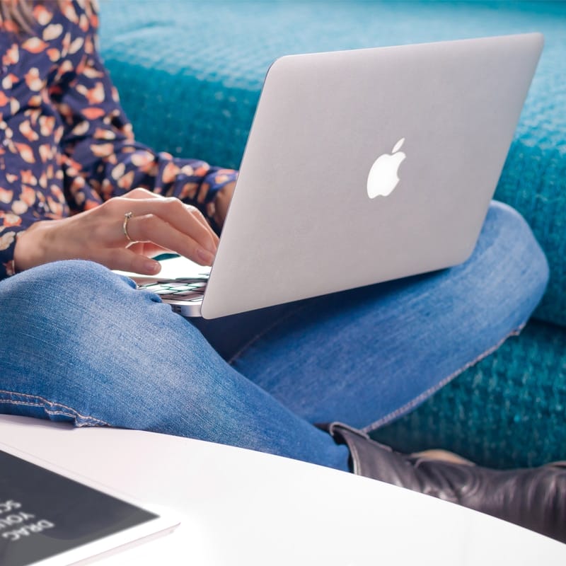 Woman Writes on Macbook Air Free Mockup PSD