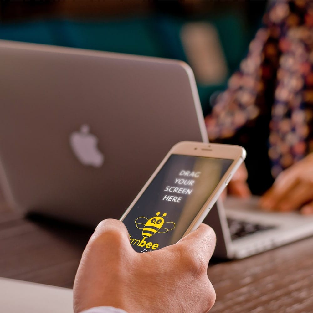iPhone on Man's Hand Free Mockup PSD