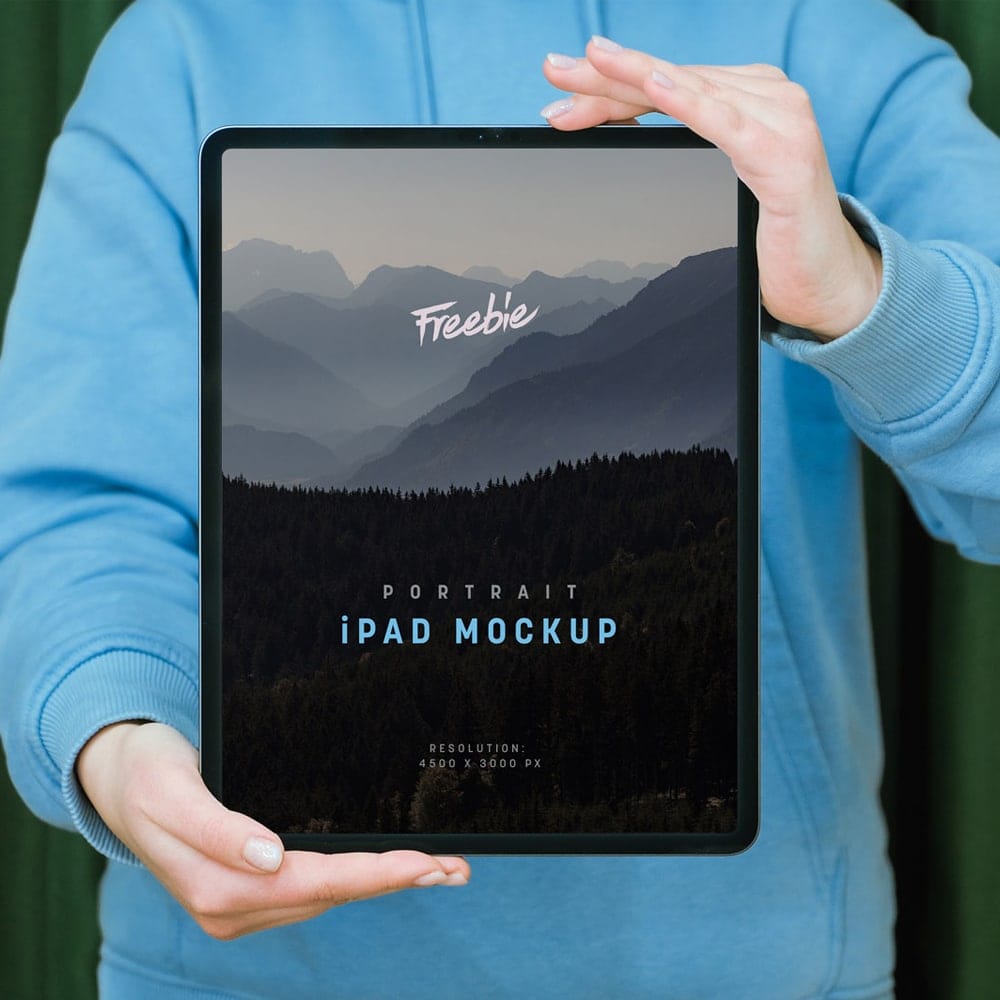 Free Hand Holding iPad Pro Mockup PSD