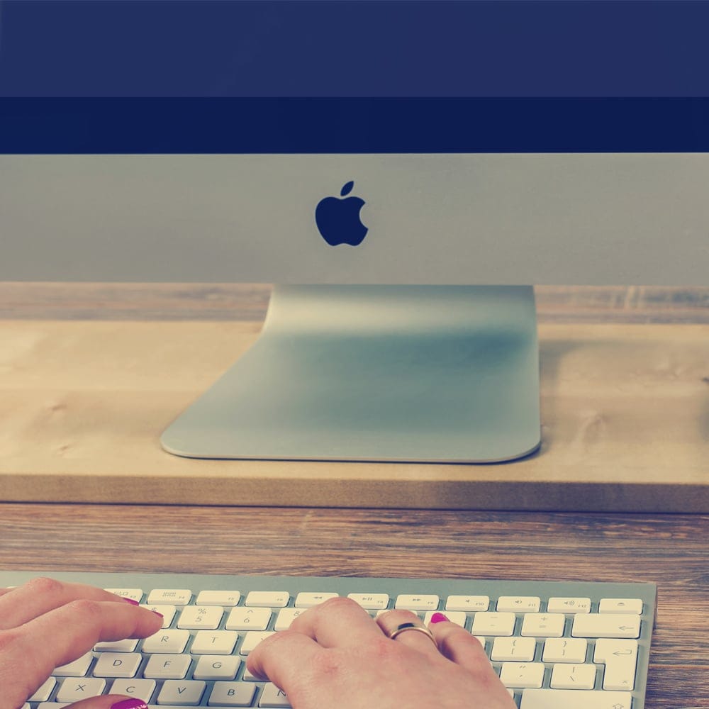 Freelance Working On Apple MacBook Free Mockup PSD