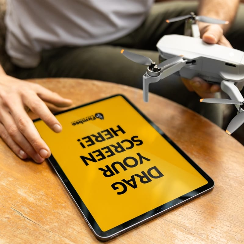 Man With Mavic Drone And Apple iPad Free Mockup PSD