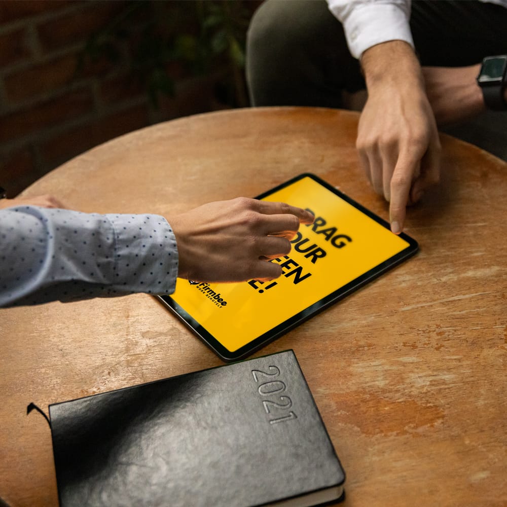 Man and Woman Discuss and use Apple iPad Air Free Mockup PSD