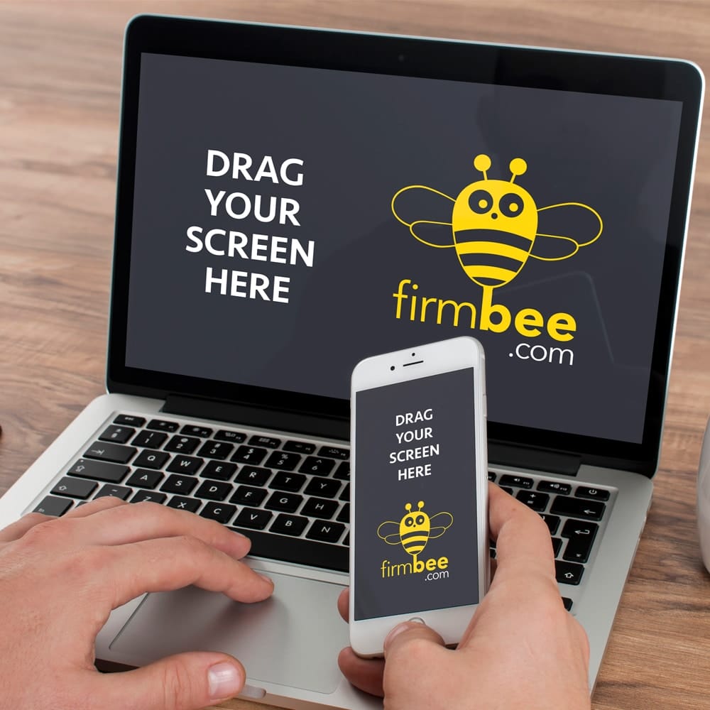 Man working on Laptop with Samsung Smartphone Free Mockup PSD