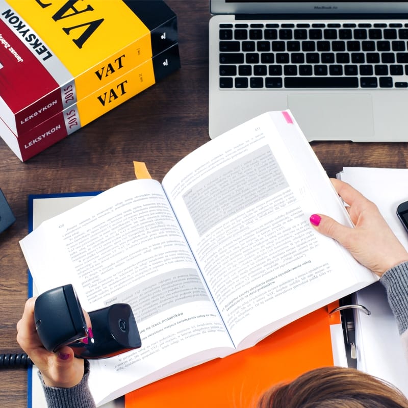 Reading Tax Book In The Office Mockup PSD