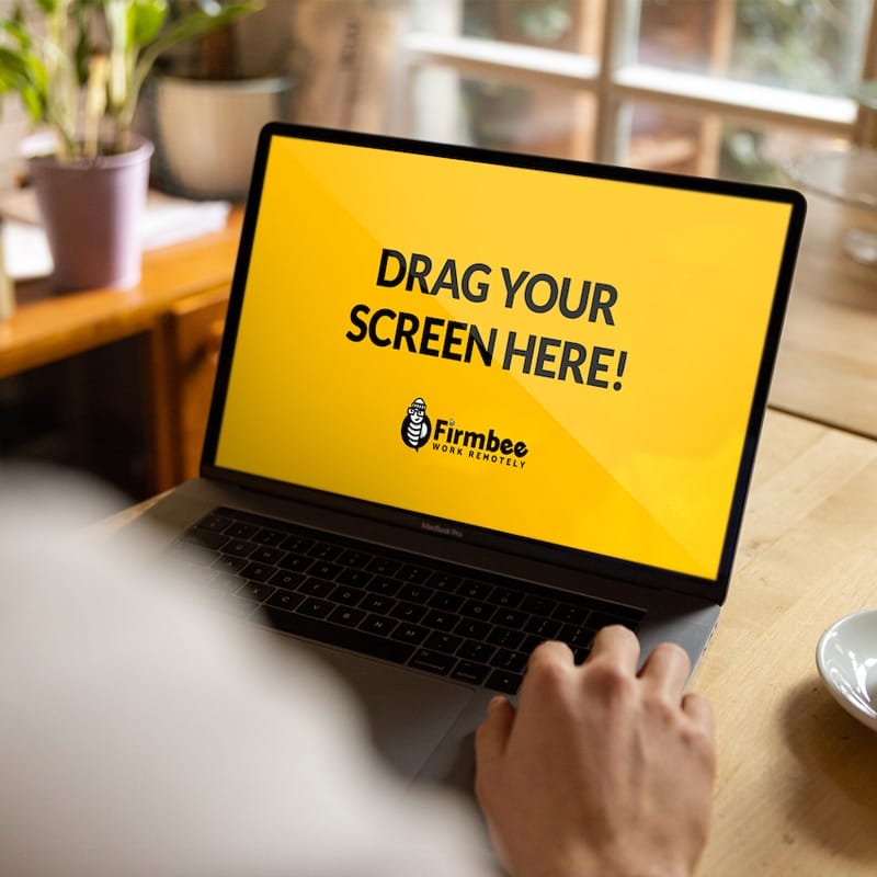 Working on MacBook at Modern Restaurant Free Mockup PSD