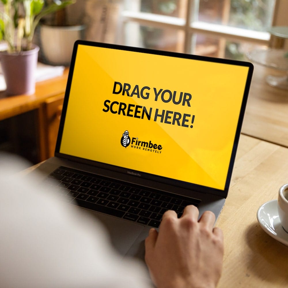 Working on MacBook at Modern Restaurant Free Mockup PSD