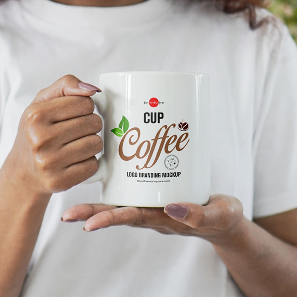 Free Girl Holding Coffee Cup For Logo Branding Mockup