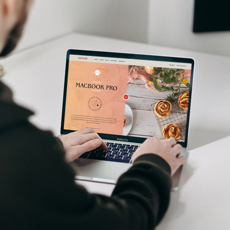 Free Man Using MacBook Pro Mockup