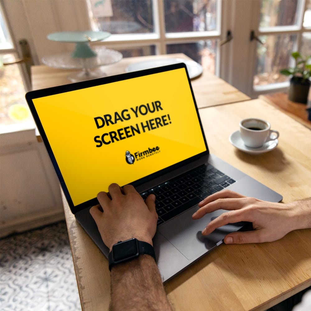 Man With Smartwatch And Coffee Uses Apple MacBook In A Cafe Free Mockup PSD