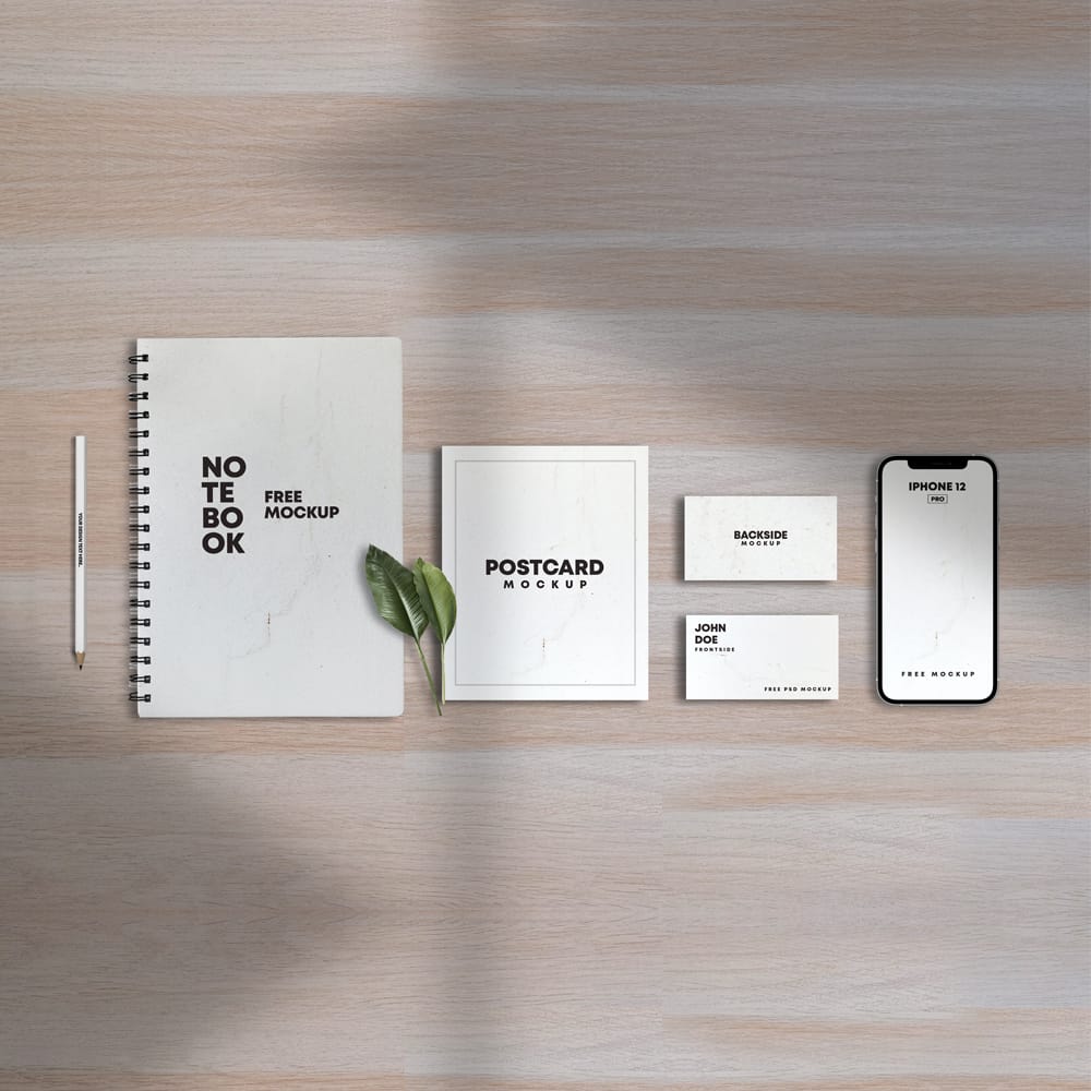 Notebook With Papers & iPhone 12 Free Mockup
