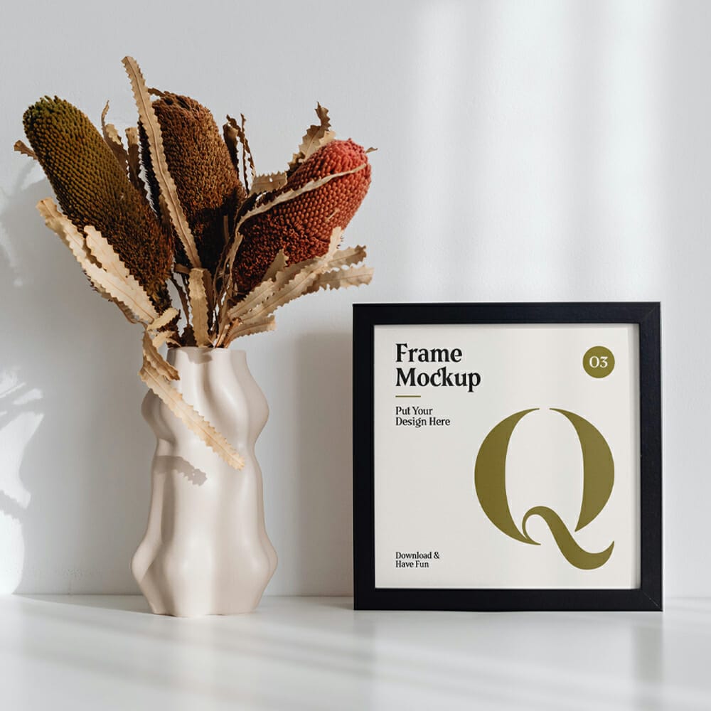 Frame with Flower on Desk Mockup