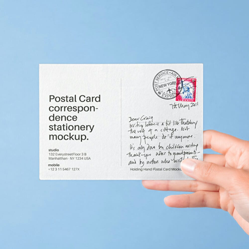 Hand Holding PSD Postal Card Mockup