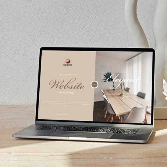 Free Laptop on Wooden Table Website Mockup Design