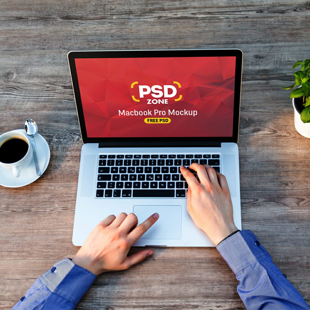 Man Working on Macbook Mockup Free PSD
