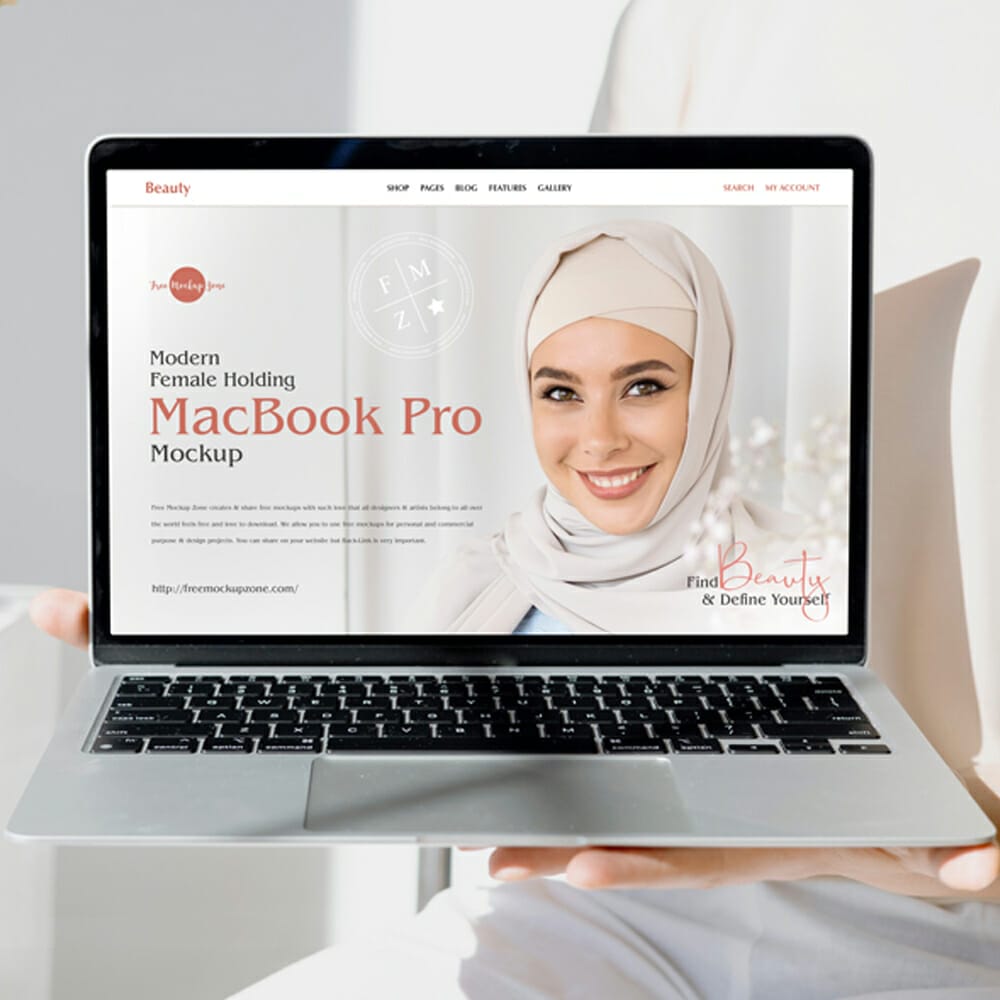 Free Modern Female Holding MacBook Pro Mockup