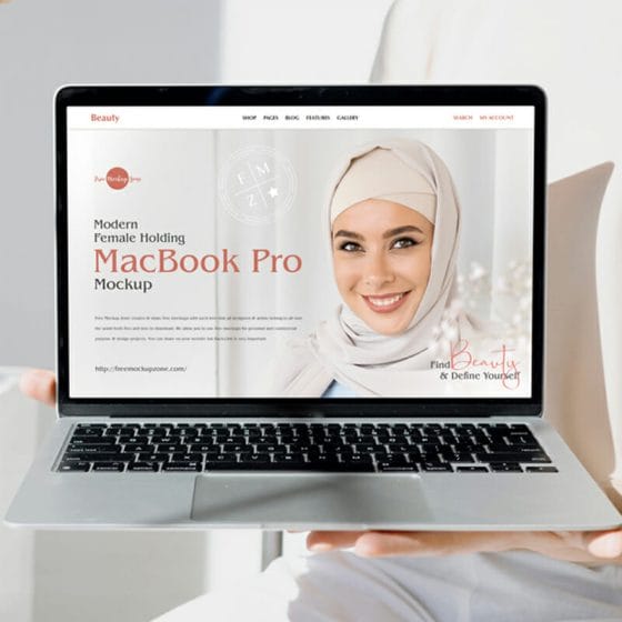 Free Modern Female Holding MacBook Pro Mockup