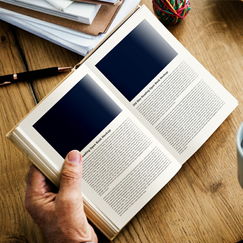 Free Old Man Reading Open Book Mockup