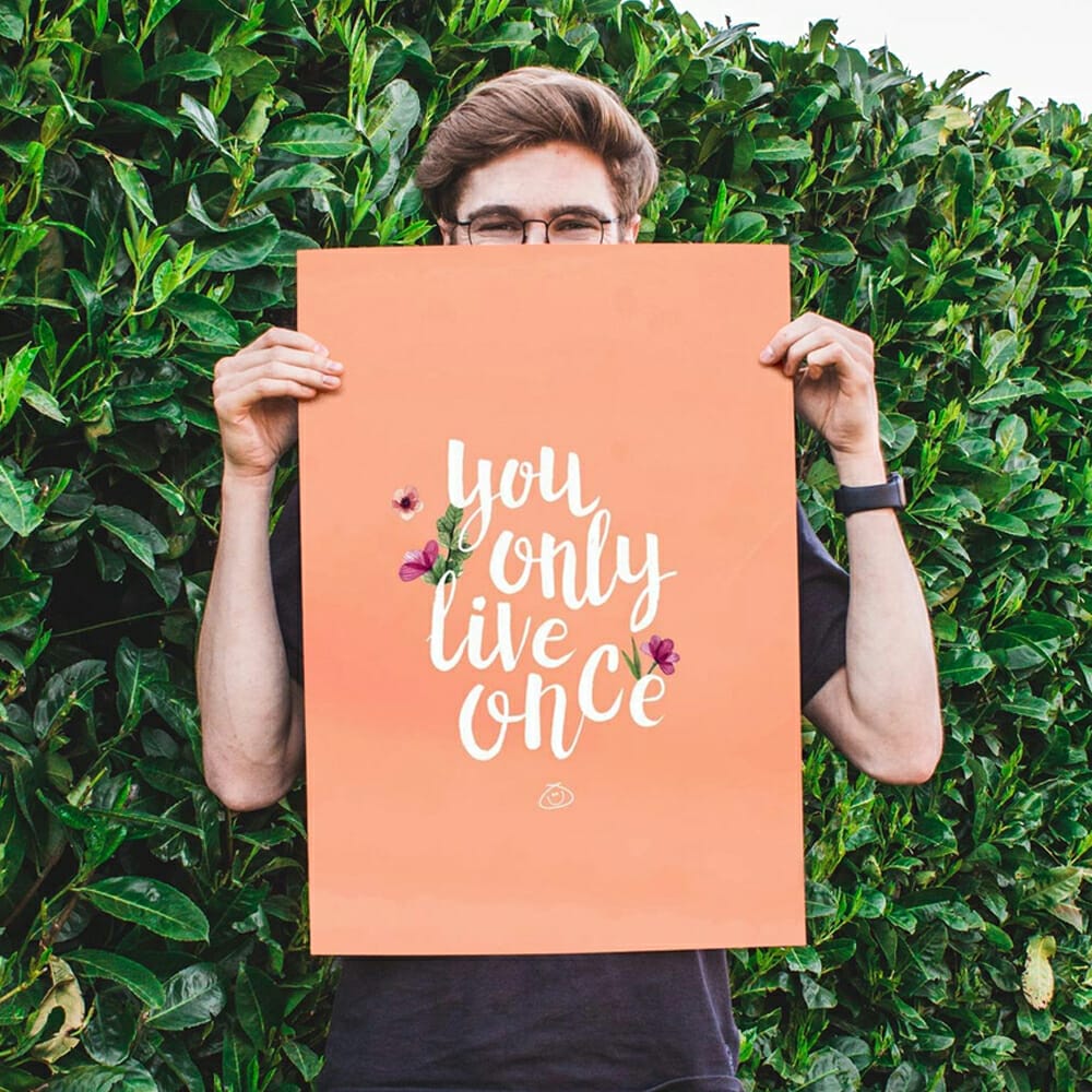 Free Hand Holding Poster Mockup PSD