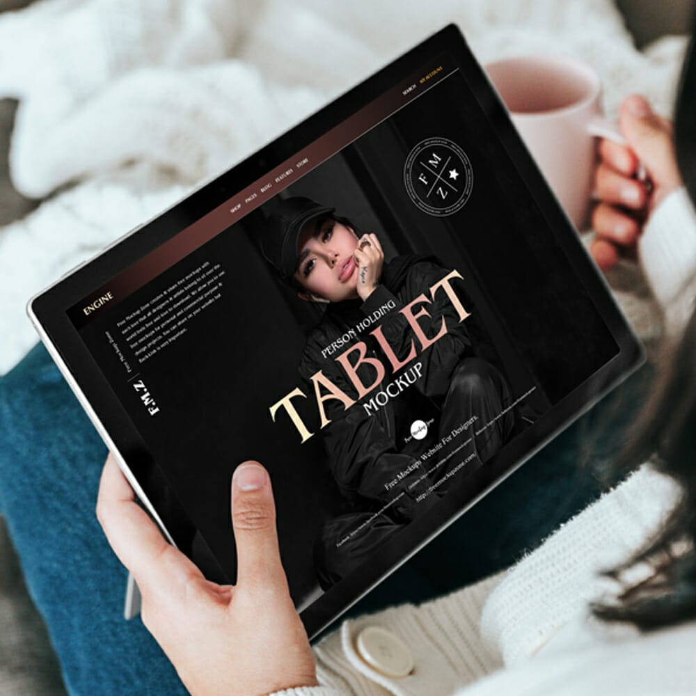 Free Person Holding Tablet Mockup PSD