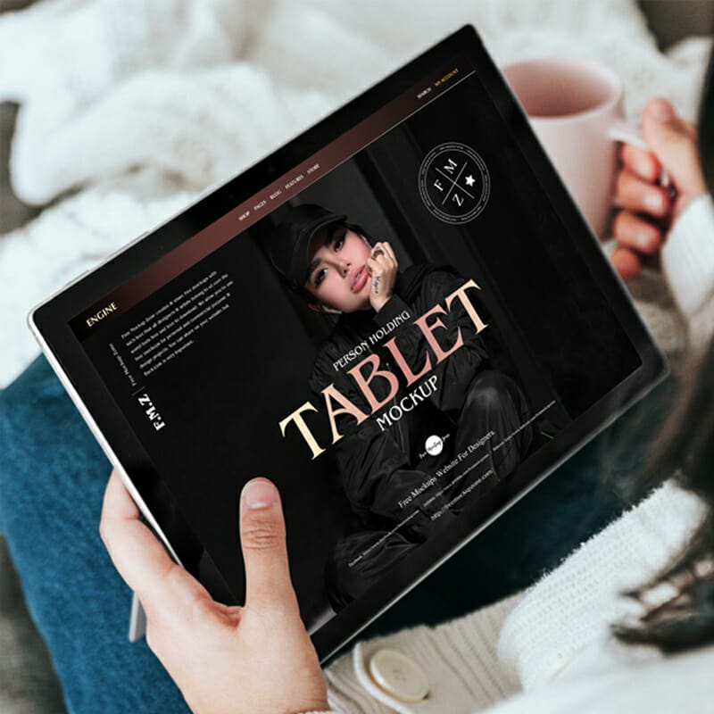 Free Person Holding Tablet Mockup PSD
