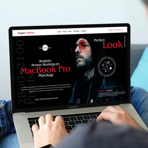 Free Realistic Person Working On MacBook Pro Mockup