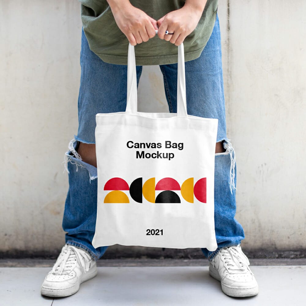 Men Holding Canvas Bag Mockup