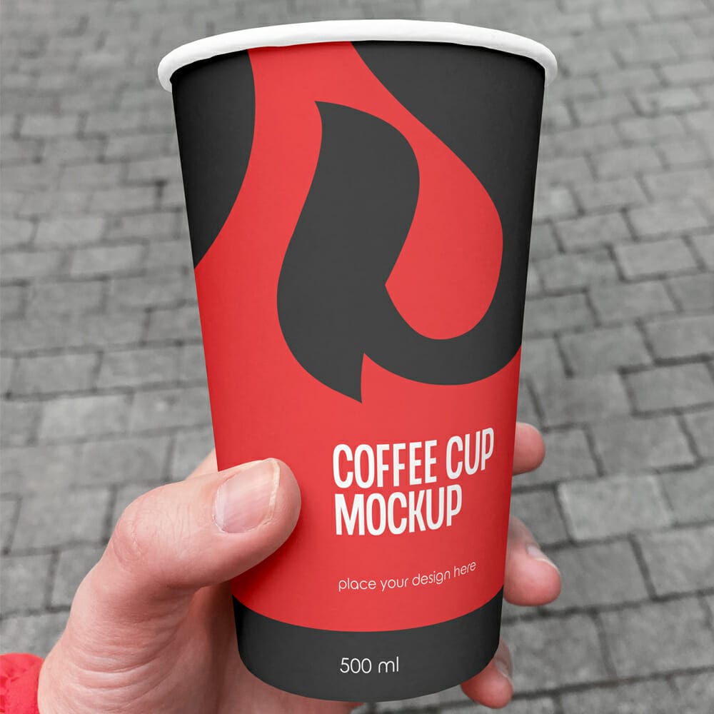 Free Tumbler Coffee Cup In Hand Mockup